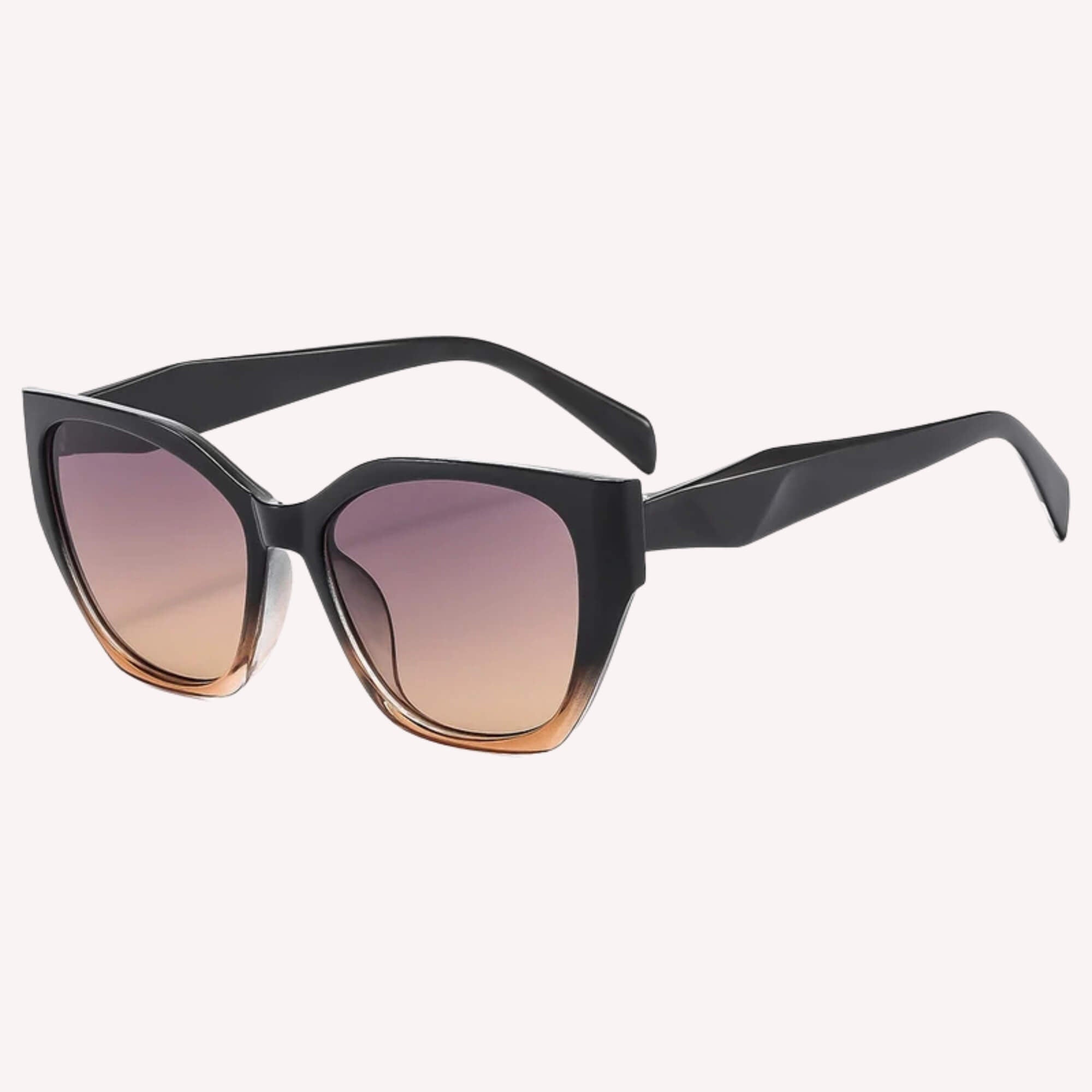 Zwart/bruin Shady Lady zonnebril – stijlvolle mix van zwart en bruin in deze grote dames zonnebril.